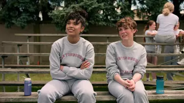 School crewneck sweater in grey worn by Dina (Sofia Bryant) in I Am Not Okay with This (Season 1)