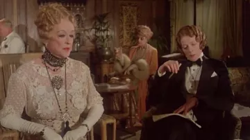 Black tuxedo suit worn by Miss Bowers (Maggie Smith) in Death on the Nile movie wardrobe