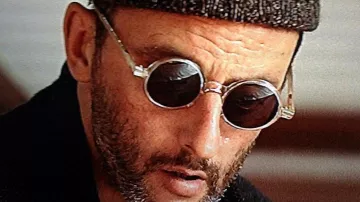 Leon: The Professional - Outfits: Jean Reno is wearing round sunglasses to portray Leon in the movie