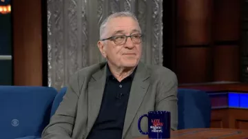 Navy Blue polo shirt worn by Robert De Niro as seen in The Late Show with Stephen Colbert on June 7, 2022
