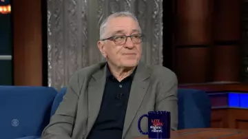 Navy Blue polo shirt worn by Robert De Niro as seen in The Late Show with Stephen Colbert on June 7, 2022