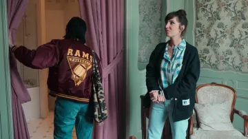 Russell Athletic Black Varsity Cardigan worn by Carla (Nora Hamzawi) as seen in Irma Vep TV show wardrobe (Season 1 Episode 2)