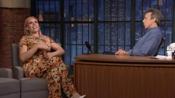 Nanushka Flowers print orange and brown Pants and Top set worn by Busy Philipps in Late Night with Seth Meyers on June 14, 2022