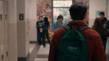 Jansport green backpack worn by Victor Salazar (Michael Cimino) as seen in Love, Victor TV series outfits (S03E03)