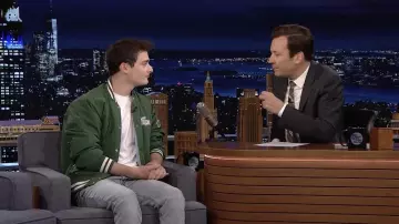 Lacoste Graphic Logo Buttoned Teddy Jacket in green worn by Noah Schnapp in The Tonight Show Starring Jimmy Fallon on June 16, 2022