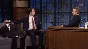Burgundy polka-dot silk tie worn by John Mulaney as seen in Late Night with Seth Meyers