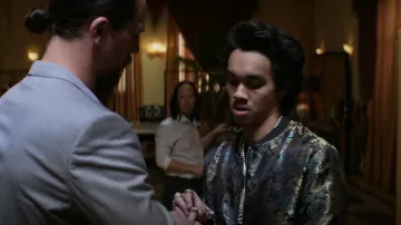 Jogal Flo­ral Bomber Jack­et worn by Manny (Rigo Sanchez) as seen in Animal Kingdom (S06E04)