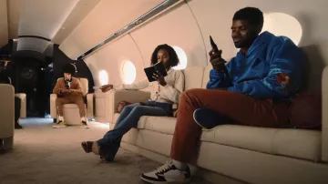 Jordan x Travis Scott Air Jordan 1 Low OG SP sneakers worn by Tom Swift (Tian Richards) as seen in Tom Swift (S01E04)