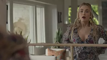 The long floral dress worn by Maggie (Rebecca Rittenhouse) in the series Maggie (Season 1 Episode 1)