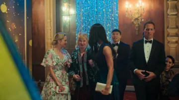 Floral Clutch worn by Ainsley (Stephanie Styles) as seen in Loot (S01E06)