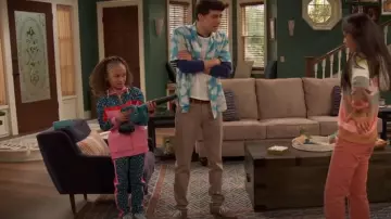 The Marc Jacobs Cheetah Track Trousers worn by Booker Baxter (Mykal-Michelle Harris) as seen in Raven's Home (S05E15)