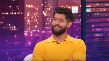 Theory Birke Regular Fit Polo Sweater worn by Hunter March as seen in E! News Nightly Pop on 28 July 2022