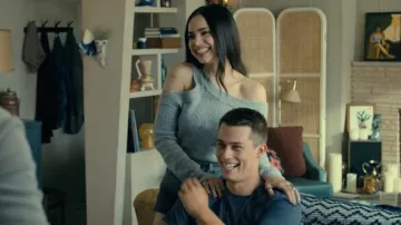 Grey asymetric ribbed top worn by Cassie (Sofia Carson) as seen in Purple Hearts