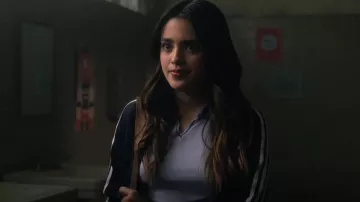Adidas Es­sen­tials Tri­cot Track Jack­et worn by Noa Olivar (Maia Reficco) as seen in Pretty Little Liars: Original Sin (S01E09)