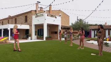 Saint Laurent Paige Heart Print Red Platform Leather Sandals worn by Laura Whitmore as seen in Love Island (S08E01)