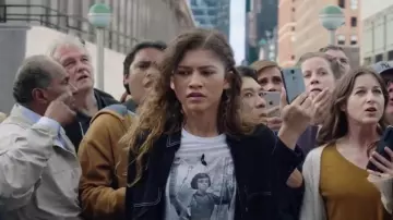 Tee-shirts from Spider-Man: No Way Home: Zendaya is wearing "Joan of Arc" Graphic White Tee to portray MJ in the Marvel's movie