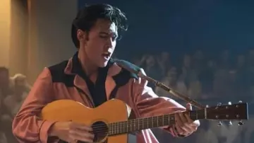 The black and pink suit set with blazer jacket, shirt and pants worn by Elvis (Austin Butler) in the movie Elvis