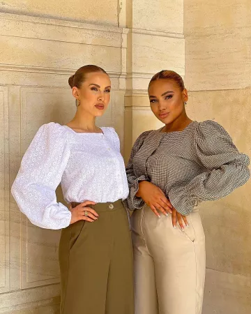 The white top worn by a model on @flawlessbyanais's Instagram account