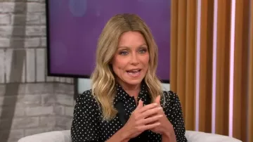 Saint Laurent Tie-Neck Polka-Dot Silk Blouse worn by Kelly Ripa as seen in CBS Mornings on September 27,2022