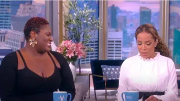 Carolina Herrera Long Sleeve Ruffle Neck Mini Dress worn by Sunny Hostin as seen in The View on October 7, 2022