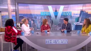 Versace La Greca Monogram Wool Cardigan worn by Whoopi Goldberg as seen in The View on October 18, 2022