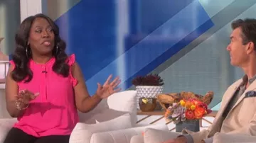 DKNY Petite Sleeveless Ruffled Blouse worn by Sheryl Underwood as seen in The Talk on October 17, 2022