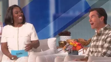 Calvin Klein Short Sleeve Drawstring Jacket worn by Sheryl Underwood as seen in The Talk on October 19, 2022