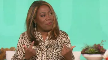 Vince Camuto Cheetah Print Ruffle Sleeve Popover Blouse worn by Sheryl Underwood as seen in The Talk on October 21, 2022
