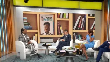 Thom Brown Clas­sic Rise Back­strap Pleat­ed Skirt worn by Billy Porter as seen in CBS Mornings on October 24, 2022