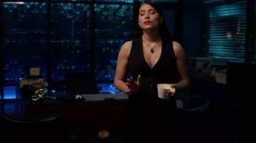 Saint Laurent Pin­striped V-neck Vest worn by Nadia Morales (Eva De Dominici) as seen in The Cleaning Lady (S02E06)