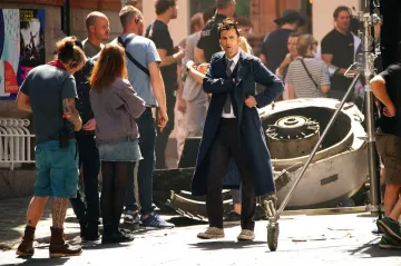 Converse sneakers in grey worn by David Tennant on the set of Doctor Who TV series in London on June 2022