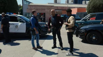 Nike Jordan 1 sneakers in black and white worn by Devin Roundtree (Caleb Castille) as seen in NCIS: Los Angeles (S14E05)