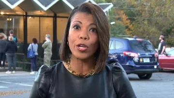 Ann Taylor Faux Leather Puff Sleeve Flare Dress worn by Nikole Killion as seen in CBS Mornings on November 8, 2022