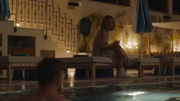 Converse sneakers in white worn by Portia (Haley Lu Richardson) as seen in The White Lotus TV series wardrobe (Season 2 Episode 3)