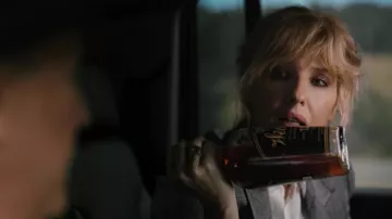 Weller Kentucky Bourbon Whiskey bottle held by Beth Dutton (Kelly Reilly) in Yellowstone TV show (Season 5 Episode 1)