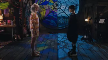 Converse Chuck '70 Hi Sun­flower Yel­low Sneak­ers worn by Enid Sinclair (Emma Myers) as seen in Wednesday (S01E01)