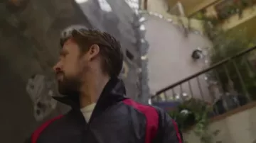 Red and Black Zip Track Jacket worn by Court Gentry (Ryan Gosling) as seen in The Gray Man movie outfits