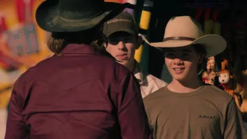 Ariat brown t-shirt worn by Tate Dutton (Brecken Merrill) as seen in Yellowstone (S05E07)