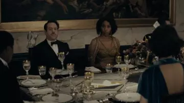 The gold dress worn by Eulalie Hicks / Lally (Jessica Williams) in the movie Fantastic Beasts - Dumbledore's Secrets