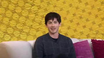 Knickerbocker Check V-Sweater in Charcoal worn by Logan Lerman as seen in Today on January 11, 2023