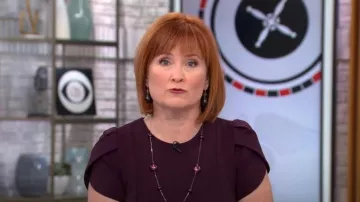 Calvin Klein Tulip Sleeve Sheath in Aubergine worn by Anna Werner as seen in CBS Mornings on January 17, 2023