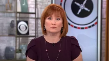 Calvin Klein Tulip Sleeve Sheath in Aubergine worn by Anna Werner as seen in CBS Mornings on January 17, 2023