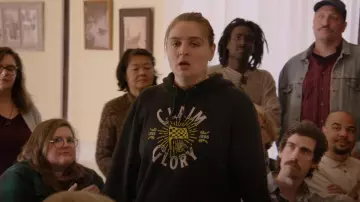 Columbus Crew Fanatics Branded Black Glory Flag Pullover Hoodie worn by Kelly Mallet (Chelsea Holmes) as seen in Welcome to Flatch (S02E12)