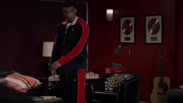 Fila Red and blue velvet tracksuit worn by Mitchell 'Divine' Diggs (Julian Elijah Martinez) as seen in Wu-Tang: An American Saga (S03E01)