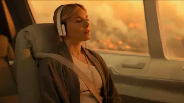 White headset worn by Rebecca Shearer (Sienna Miller) as seen in Extrapolations (Season 1)