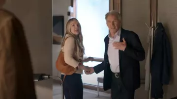 Clare V Moyen Messenger worn by Meg (Lily Rabe) as seen in Shrinking (S01E04)