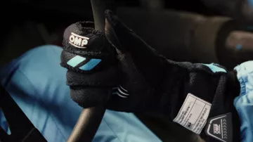 OMP Racing Gloves worn by Davis McDowell (Charles Melton) as seen in Poker Face (S01E07)