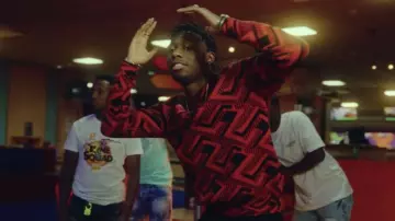 The red and black Prada patterned sweater worn by Tiakola in her music video Étincelle (Maradona)
