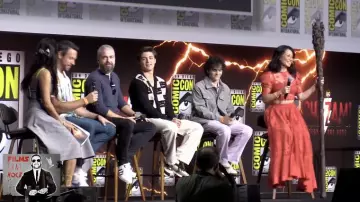 Acne Studios logo-intarsia checkerboard cardigan in Black and worn by Asher Angel for Shazam! Fury of the Gods Comic Con 2022 full panel