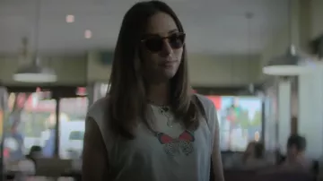 Rag & Bone But­ter­fly Cropped Mus­cle Tank worn by Elena Santos (Mariel Molino) as seen in The Watchful Eye (S01E06)